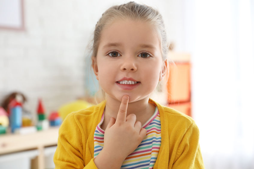 Cute little girl at speech therapist office