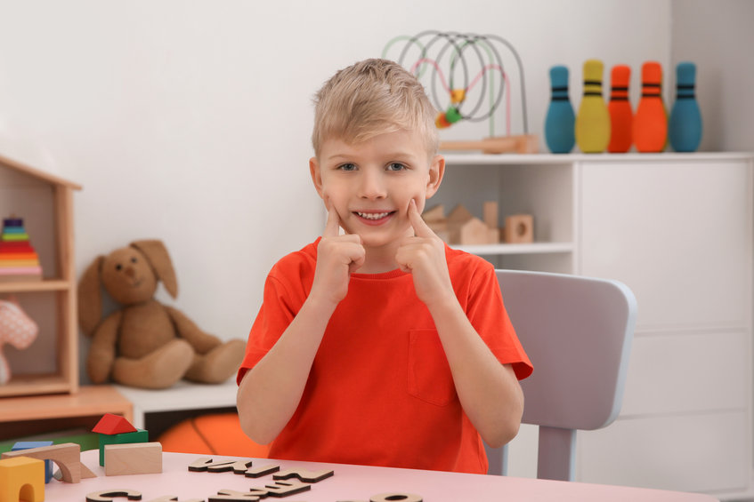 Cute little boy at speech therapist office
